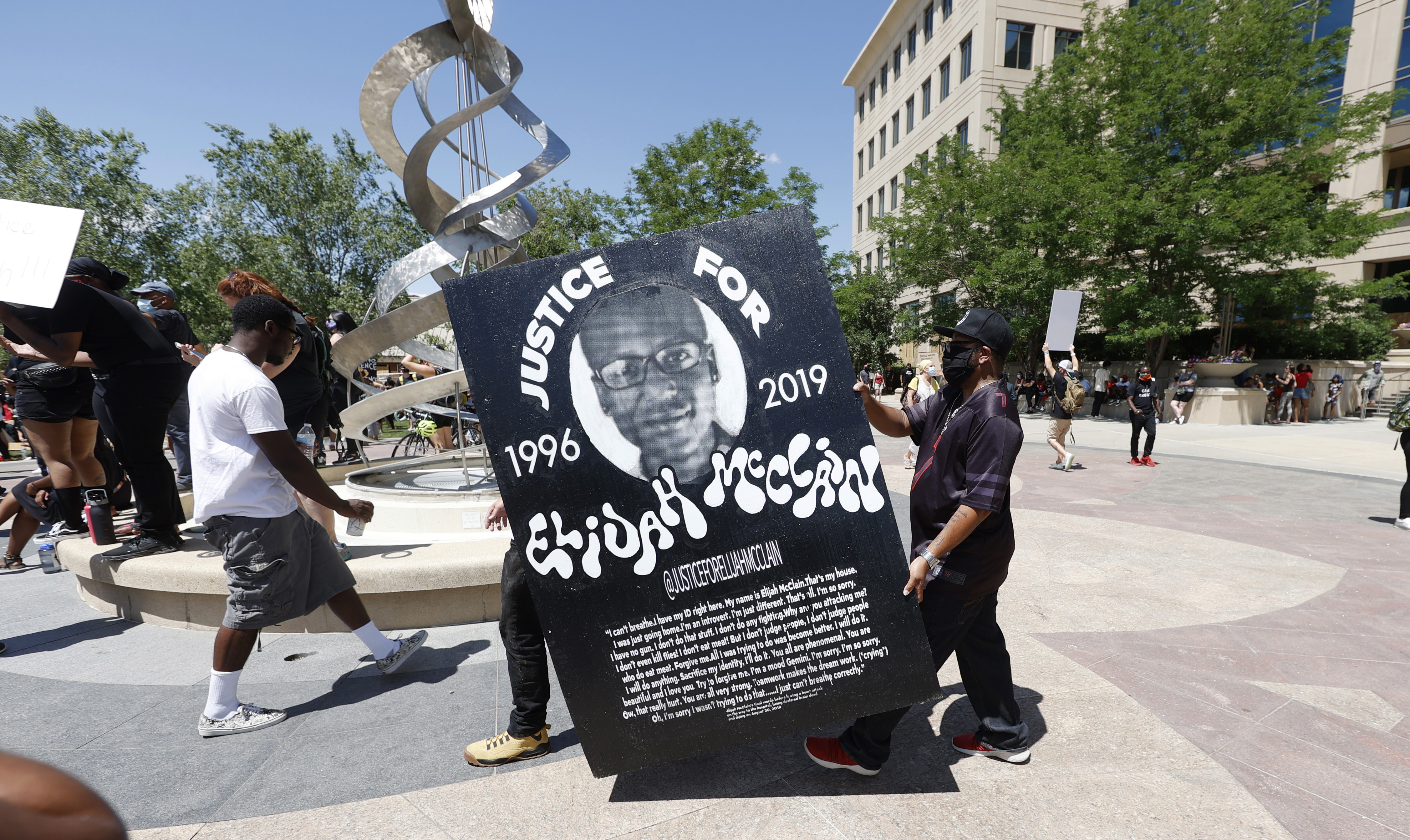 Colorado court overturns homicide convictions of 2 paramedics in death of Black man pinned by police